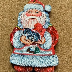 G. DeBrekht Santa holding kittens